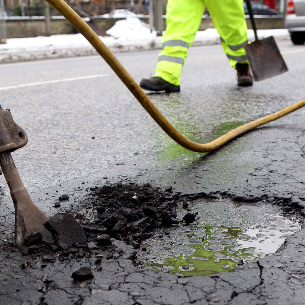 Repairing potholes all across London